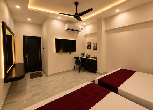 <p>Offering extra space and four comfortable beds, this deluxe room is well suited for families and groups visiting Puri.</p>